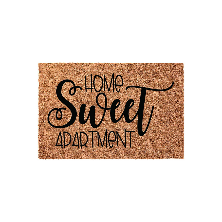 Home Sweet Apartment coir doormat featuring a natural brown fiber texture and bold black lettering in a mix of script and sans-serif fonts, centered on a clean white background for a modern and welcoming entryway decor aesthetic.