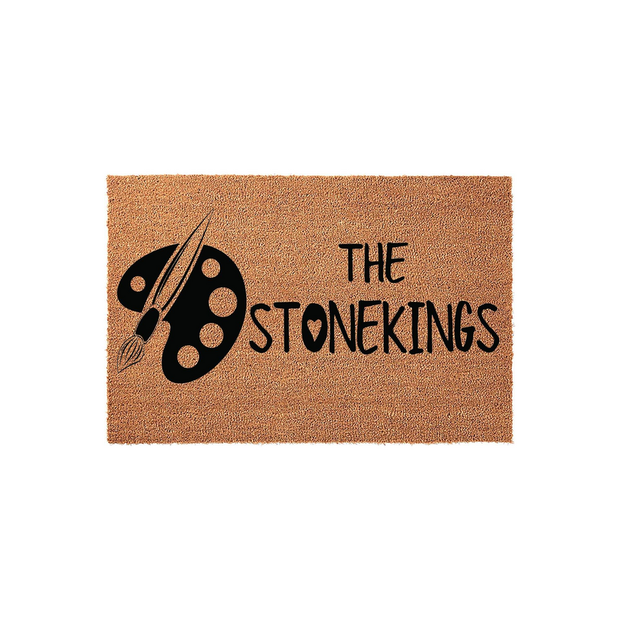 Personalized Artist Themed Coir Doormat featuring a black paint palette and brush graphic on a natural tan fiber background, with custom family name text printed in a clean, modern font for a creative home entryway decor