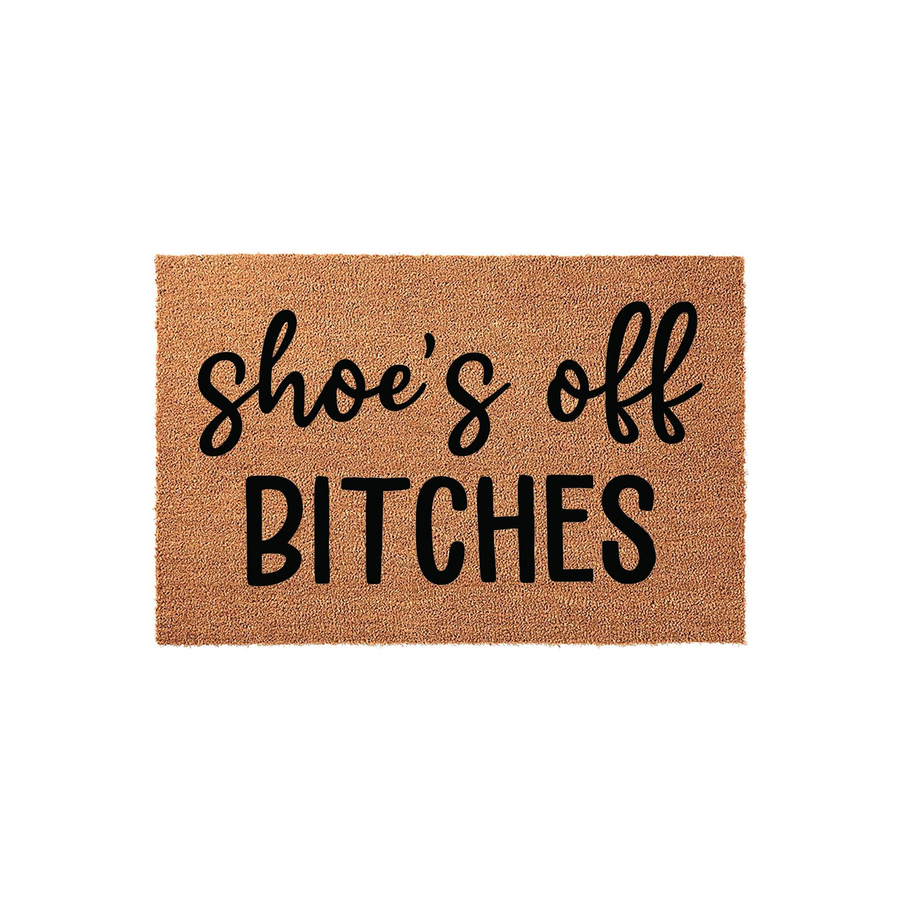 Funny Shoe's Off Bitches doormat made of natural coir fiber, featuring a bold black script and block letter design that adds a humorous touch to any front porch entryway or home decor setting for guests to see.