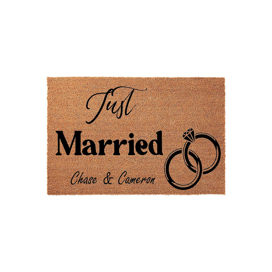 Personalized Just Married coir doormat featuring a natural tan fiber texture, black printed text, and an elegant interlocking wedding ring design, making it a charming housewarming or wedding entry decor piece for a newlywed