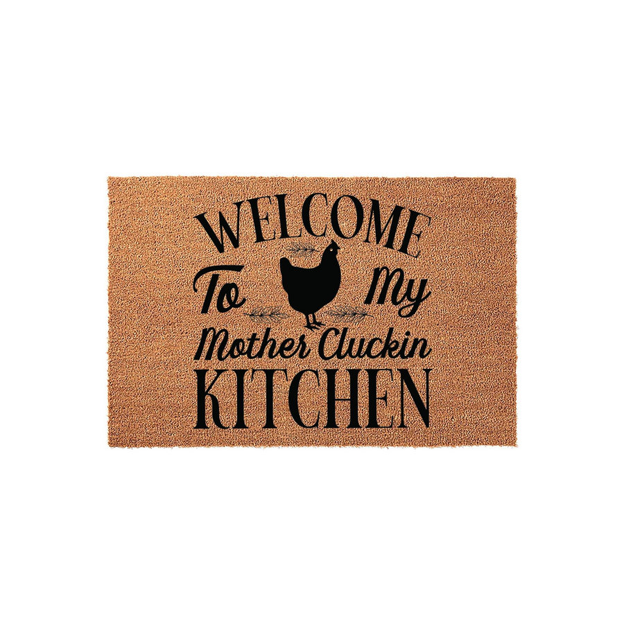 Funny Chicken Kitchen Doormat featuring a natural coir texture and black printed text that reads Welcome To My Mother Cluckin Kitchen, complete with a silhouette of a hen for a farmhouse style home decor accent on a plain white