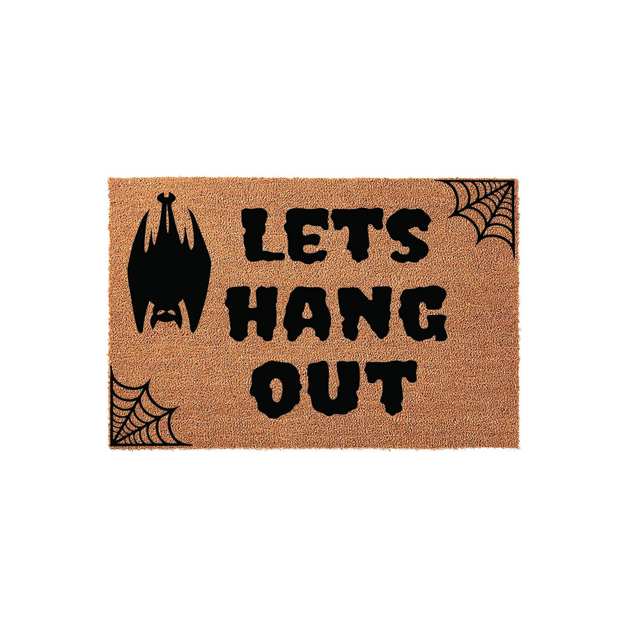 Halloween Bat Welcome Doormat featuring a natural coir texture with black printed text that says Lets Hang Out, accented by a hanging bat illustration and spider web corners for a spooky seasonal entryway decor piece.