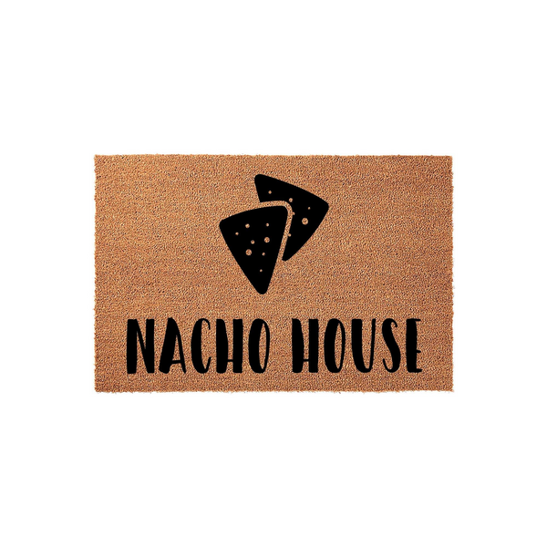 Nacho House coir doormat featuring a fun, black graphic of two tortilla chips centered above the bold, playful text, set against a natural brown fiber background that adds a humorous touch to any front porch or entryway decor.