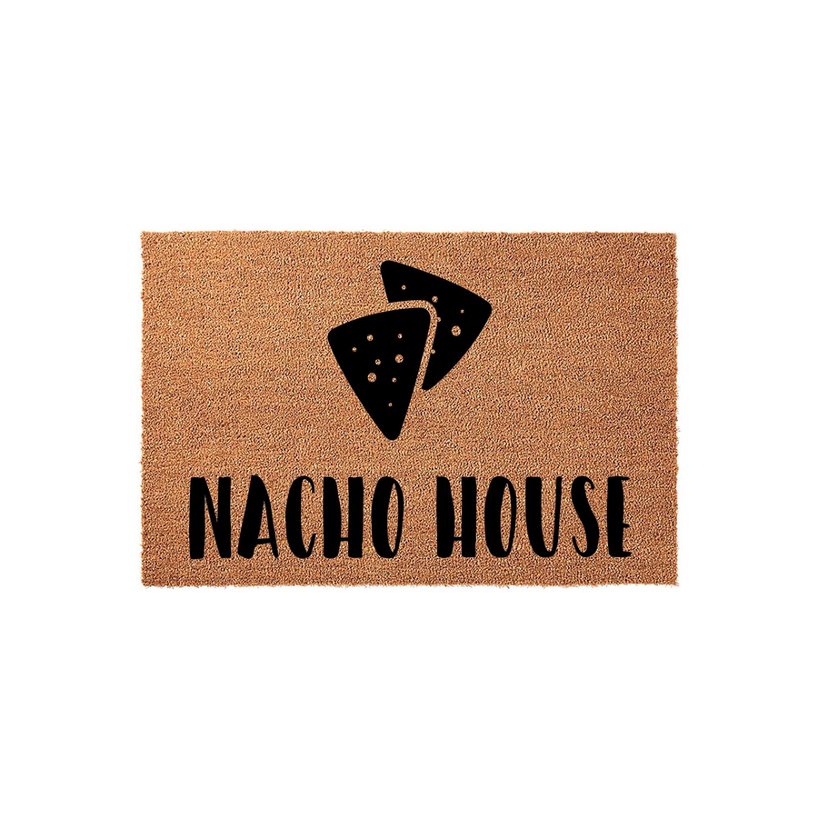 Nacho House coir doormat featuring a fun, black graphic of two tortilla chips centered above the bold, playful text, set against a natural brown fiber background that adds a humorous touch to any front porch or entryway decor.