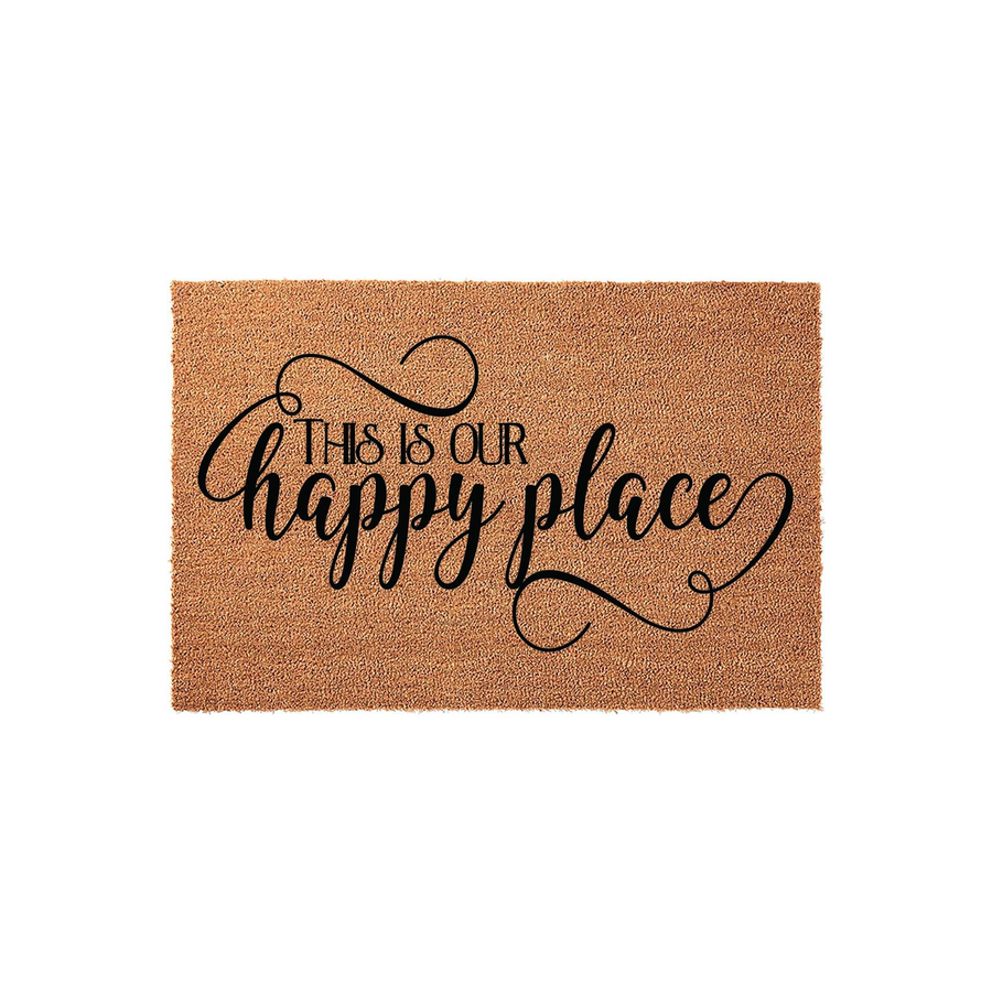 This Is Our Happy Place coir doormat features a natural tan fiber texture with bold black script lettering, making it a welcoming front porch decor piece for any home entrance that adds a touch of charm to your outdoor living