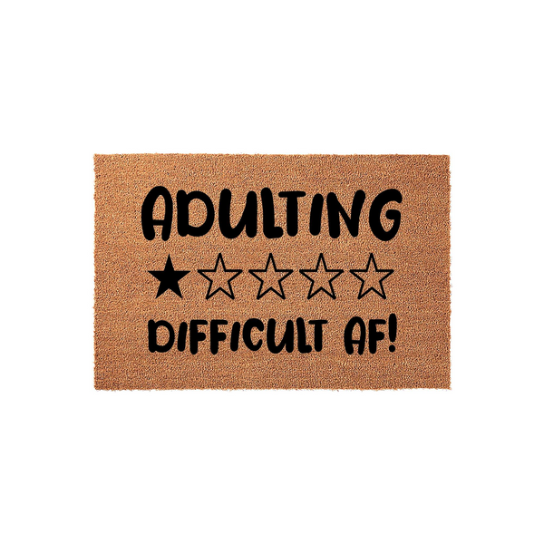 Adulting Difficult AF funny coir doormat featuring a one-star rating graphic printed in bold black text on a natural brown coconut fiber mat, creating a humorous welcome mat for a modern home entrance or apartment front door.