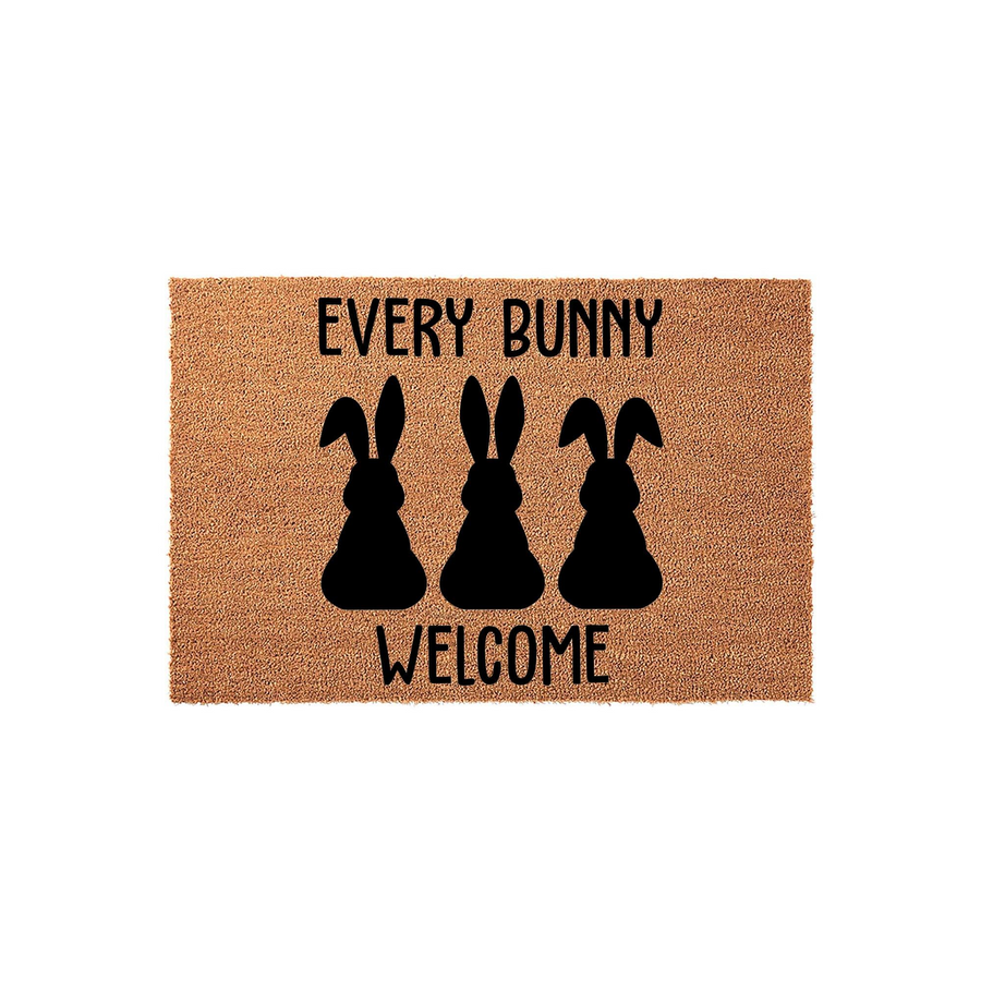 Every Bunny Welcome Easter Doormat featuring three black rabbit silhouettes printed on a natural coir fiber mat, creating a festive spring entryway decor piece that greets guests with a playful seasonal message on a plain white