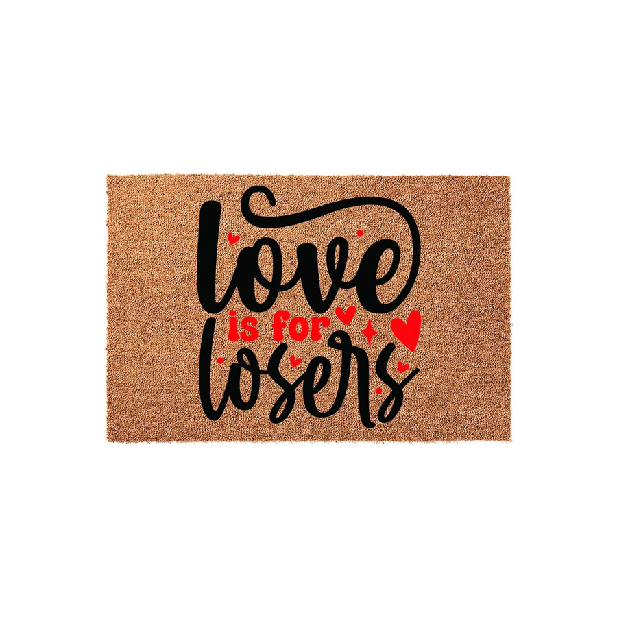 Love is for losers coir doormat featuring bold black script lettering and red heart accents on a natural tan fiber background, creating a humorous and sarcastic entryway decor piece for your home or apartment front door entrance.
