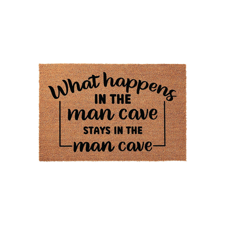Man Cave Coir Doormat featuring a natural brown fiber texture and bold black text that reads What happens in the man cave stays in the man cave, making it a humorous and functional decor piece for any home entrance or basement