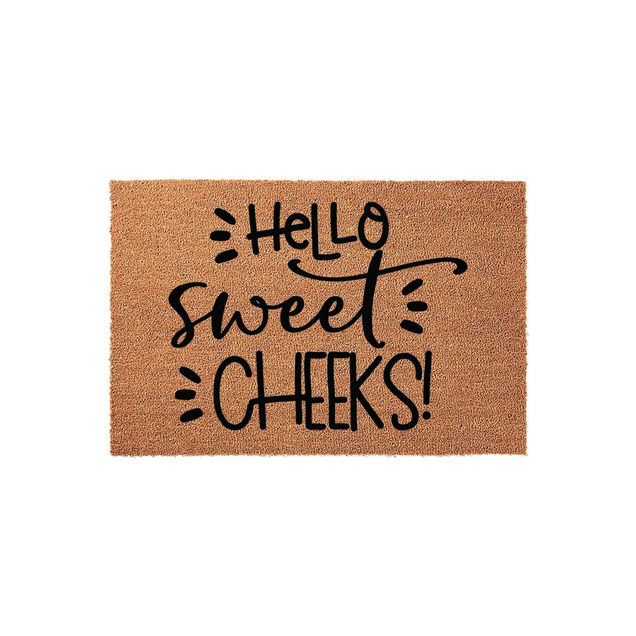 Hello Sweet Cheeks coir doormat featuring a natural tan fiber texture and bold black hand-lettered typography, providing a fun and welcoming entrance decor piece for your front porch or home entryway on a clean white background.