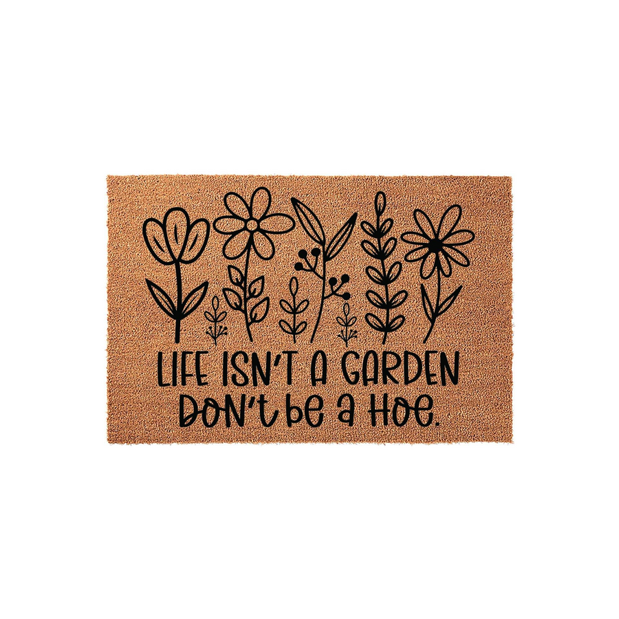 Funny Floral Garden Doormat featuring a natural coir texture with black line art of various wildflowers and the humorous text Life Isn't A Garden Don't Be A Hoe printed in a bold, clean font on a plain white studio background.