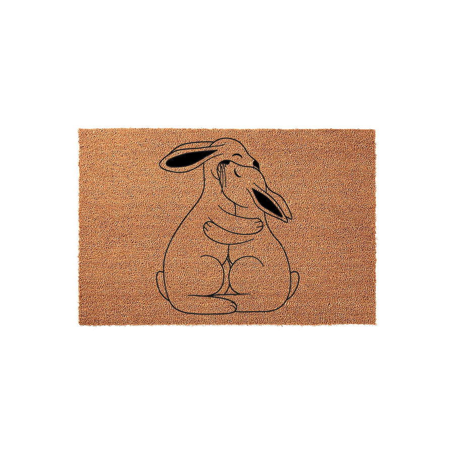 Coir Rabbit Hug Doormat featuring a minimalist black line art illustration of two bunnies embracing on a natural brown textured coir background, creating a sweet and welcoming entrance for any animal lover's home front porch.