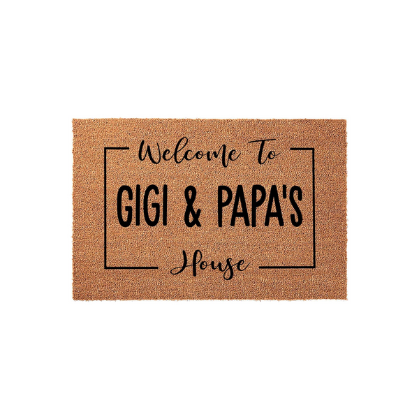 Personalized Gigi and Papa's House doormat featuring a natural coir texture with bold black text inside a simple rectangular frame, creating a welcoming entryway decor piece for a grandparent's home on a clean white background.