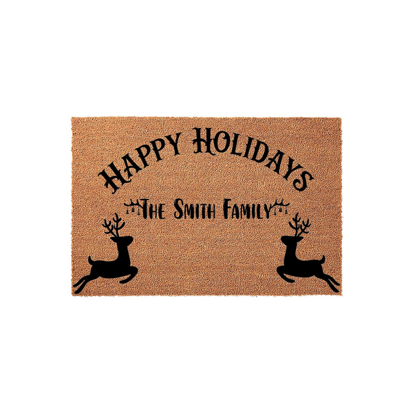 Personalized Happy Holidays coir doormat featuring a festive reindeer design and space for a family name, set against a clean white background to showcase the natural tan texture of the durable outdoor welcome mat for the winter
