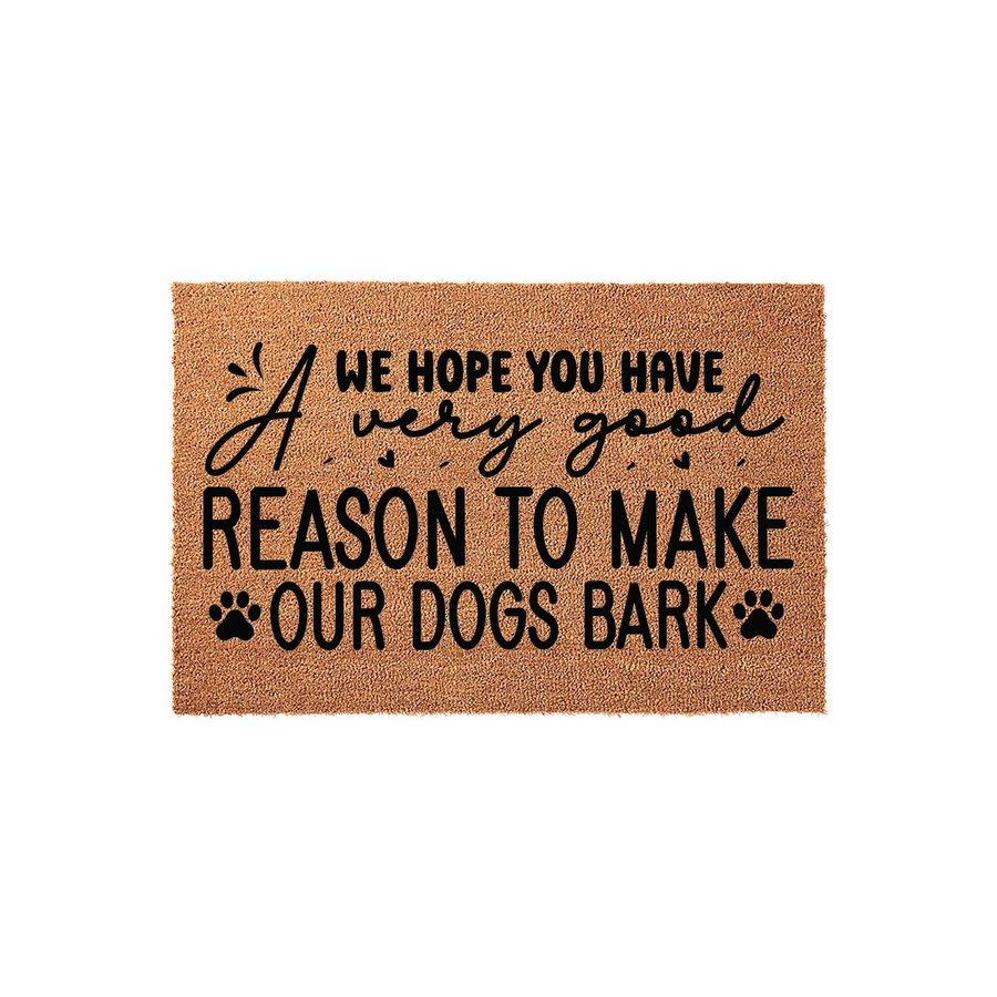 Funny Dog Lover Coir Doormat featuring the text A very good reason to make our dogs bark in black lettering on a natural brown fiber background, creating a humorous welcome mat for any home with pets and a playful sense of humor.