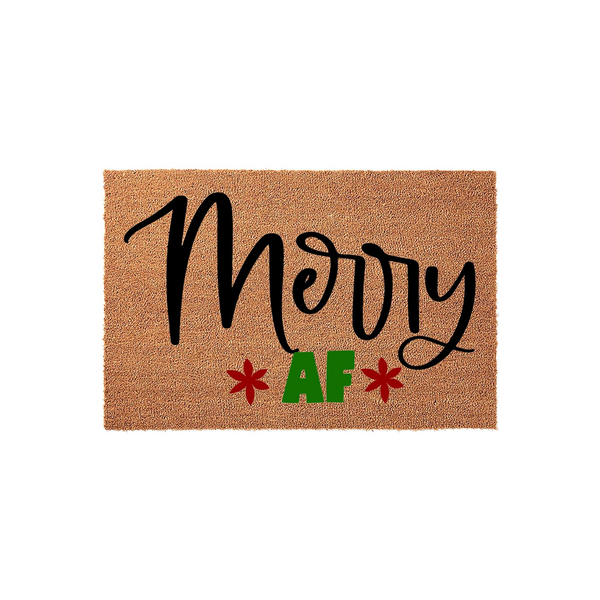 Merry AF Christmas doormat made of natural coir fiber with a rectangular shape, featuring bold black script lettering and green text accented by two red star-like floral icons on a plain white background for a festive holiday