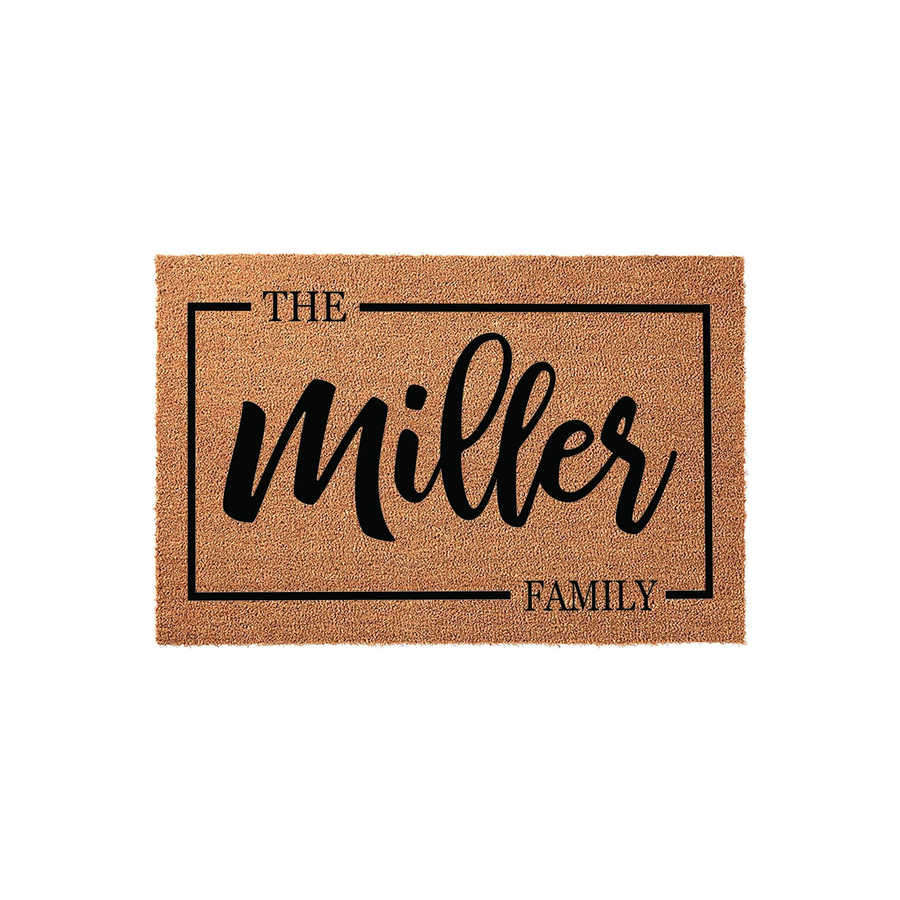 Personalized coir doormat featuring a custom family name printed in black script inside a clean rectangular border, providing a welcoming and durable entrance decor piece for any home entryway or front porch setting.