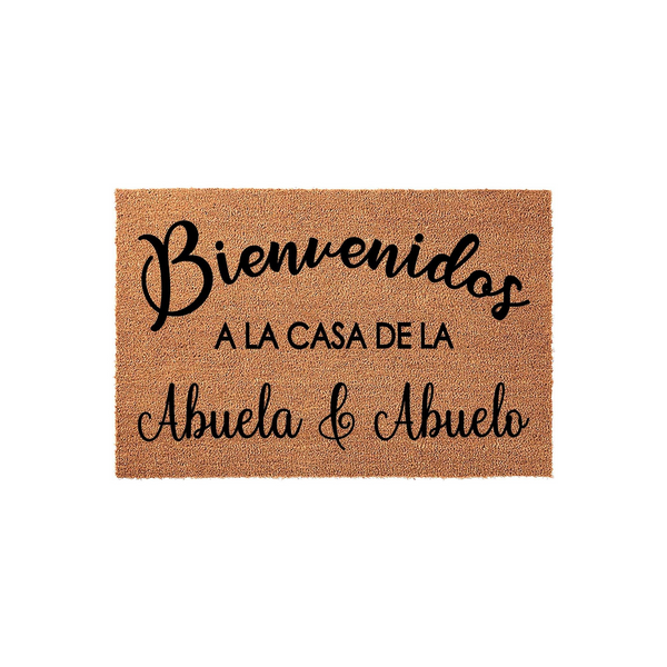 Abuela and Abuelo welcome doormat featuring natural coir fiber texture and black script lettering that reads Bienvenidos a la casa de la Abuela y Abuelo, making a warm and inviting entrance piece for a grandparent's home front