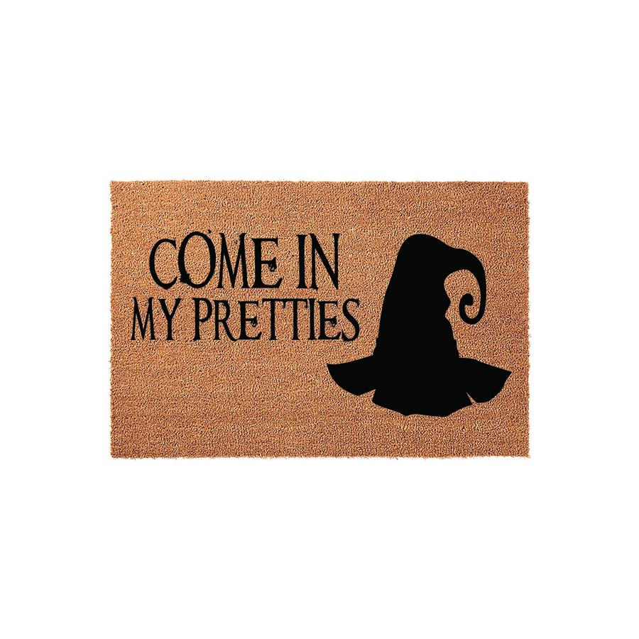 Come In My Pretties Halloween doormat featuring a black witch hat graphic on a natural coir fiber background, providing a festive and spooky entryway decoration for your front porch during the fall season and October holiday