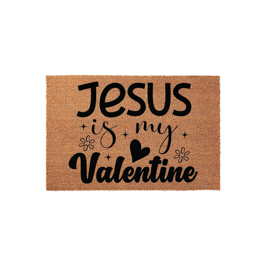 Jesus is My Valentine coir doormat featuring natural brown coconut fiber material with bold black text and decorative heart and flower accents, creating a festive religious entryway decor piece for the Valentine holiday season.