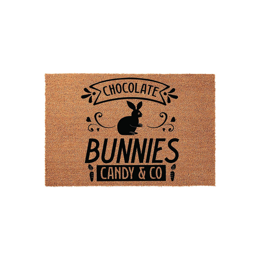 Chocolate Bunnies Candy and Co Easter doormat featuring a black silhouette of a rabbit centered on a natural coir fiber mat, accented with decorative swirls and small carrot icons for a festive spring entryway decor style.