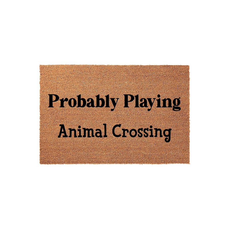 Probably Playing Animal Crossing doormat featuring a natural coir fiber texture and bold black lettering, perfect for a gamer home entrance or a fun housewarming gift for fans of the popular video game series on a plain white