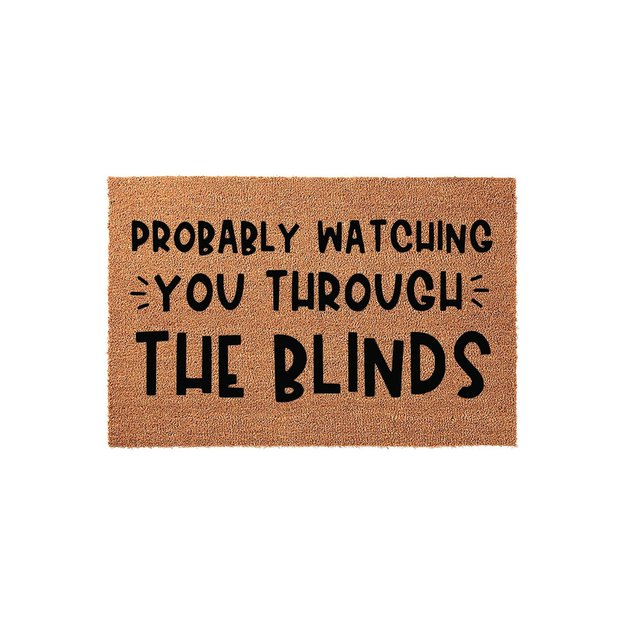 Funny Coir Doormat with the text Probably Watching You Through The Blinds printed in bold black letters on a natural brown coconut fiber background, creating a humorous and welcoming entrance for any home front porch or entryway.