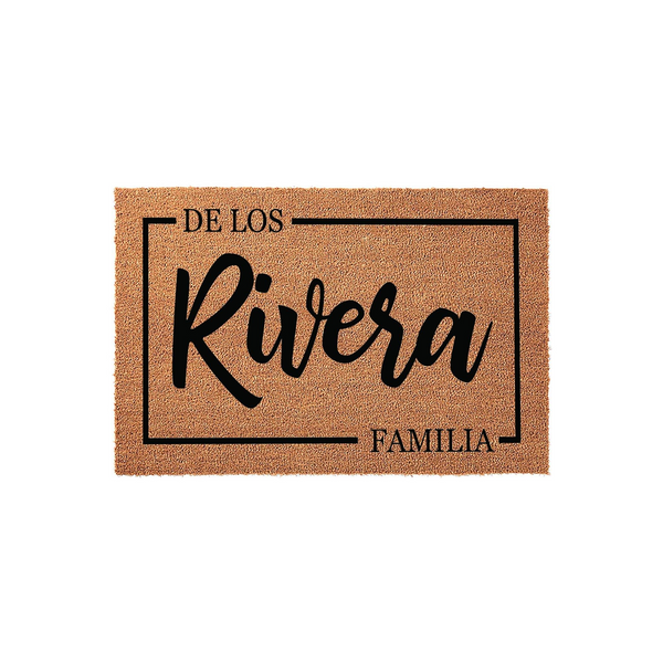 Personalized family name coir doormat featuring a rectangular border design with custom text in a modern script font, set against a clean white background to showcase the natural tan texture of the durable outdoor welcome mat