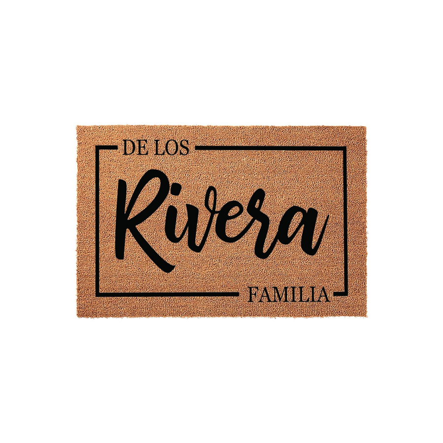 Personalized family name coir doormat featuring a rectangular border design with custom text in a modern script font, set against a clean white background to showcase the natural tan texture of the durable outdoor welcome mat