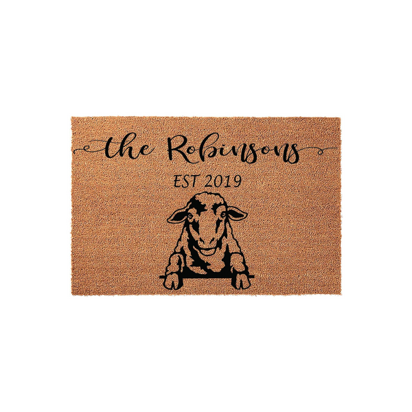 Personalized sheep doormat featuring a rustic coir texture with a black graphic of a sheep peeking over a ledge, customized with a family name and established year printed in elegant black script and serif fonts on a plain white