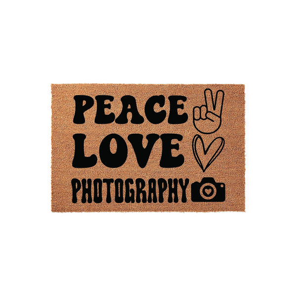 Peace Love Photography Coir Doormat featuring bold black text and icons of a peace sign, a heart, and a camera on a natural brown textured background, making it a fun and welcoming entrance mat for any professional photographer