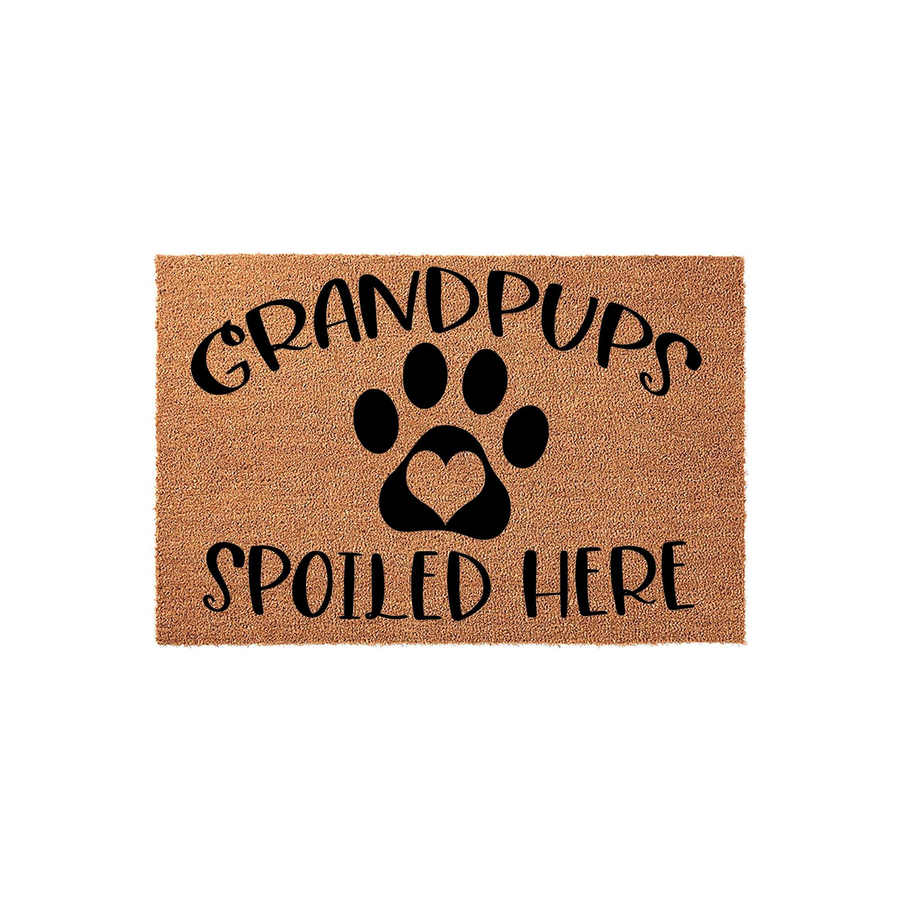 Grandpups Spoiled Here coir doormat featuring a large black paw print with a heart-shaped center pad, designed for dog lovers who want to welcome visitors to their home with a fun and durable natural fiber outdoor entrance rug.