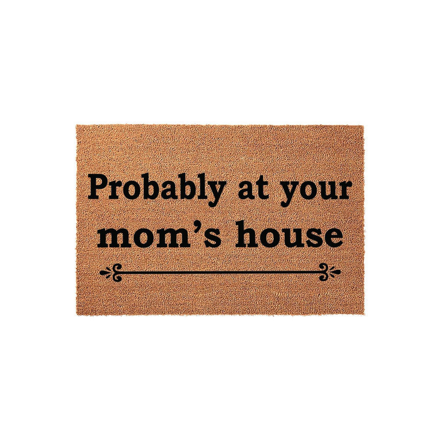 Funny Mom's House Coir Doormat featuring the text Probably at your mom's house in bold black lettering, centered on a natural brown coconut fiber mat with a decorative flourish line underneath for a humorous entryway decor accent.