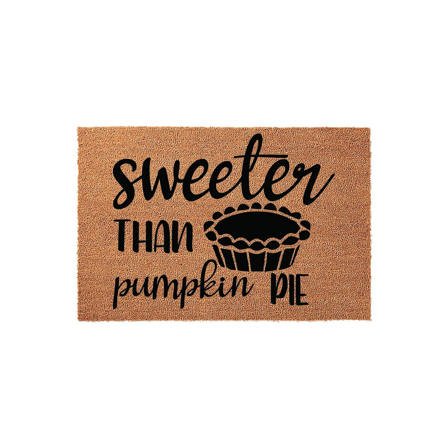 Sweeter Than Pumpkin Pie Coir Doormat featuring a natural brown fiber texture and bold black text with a graphic of a pie, making it a festive fall home decor accent for your front porch or entryway during the autumn holiday