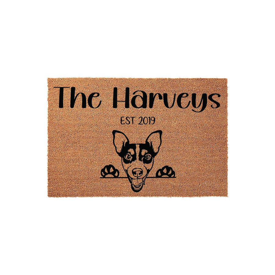 Personalized Rat Terrier doormat featuring a cute dog peeking over the edge, customized with a family name and established year on a natural coir fiber background for a welcoming front porch entrance that celebrates your pet.