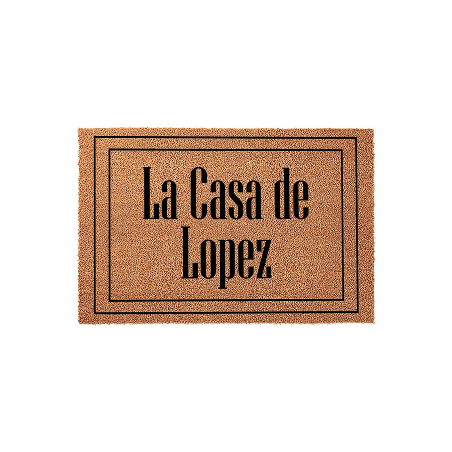 Personalized family name coir doormat featuring a classic rectangular border and bold black text that reads La Casa de Lopez, providing a durable and welcoming entrance mat for any home front porch or entryway decor.