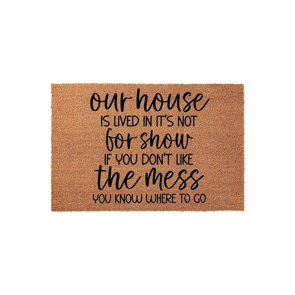 Funny Our House Is Lived In Not For Show Doormat featuring a natural coir texture with bold black typography that reads a humorous message about a messy home, presented on a clean white background for a modern farmhouse entryway