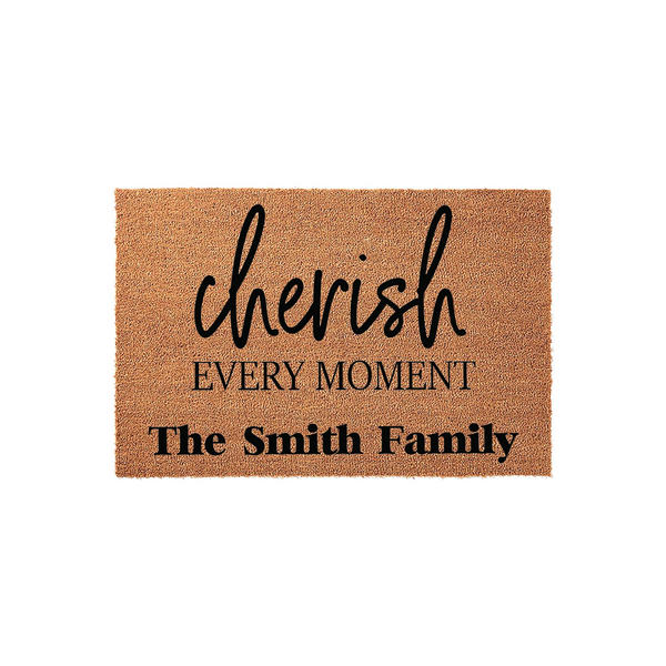 Personalized family name doormat featuring the phrase cherish every moment in elegant black script and bold lettering on a natural coir fiber background, creating a welcoming entryway decor piece for any home entrance.