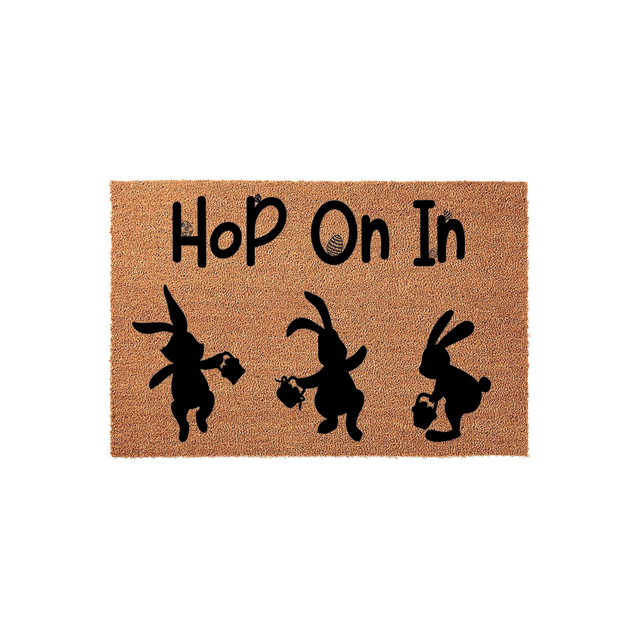 Easter Bunny Hop On In Doormat featuring a natural coir texture with three black silhouettes of rabbits carrying baskets, creating a festive spring entryway decor piece for your front porch or home entrance.
