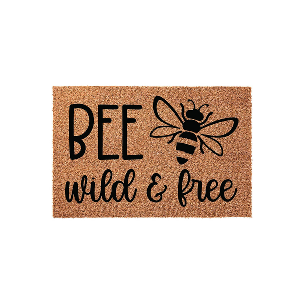 Bee Wild and Free coir doormat featuring a natural brown fiber texture with black printed text and a cute bumblebee illustration, making a charming outdoor welcome mat for your front porch or entryway decor in a rustic farmhouse