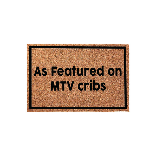 As Featured on MTV Cribs doormat featuring a natural coir fiber texture with a bold black rectangular border and clean sans-serif lettering, providing a fun and nostalgic welcome for any front porch or entryway decor.