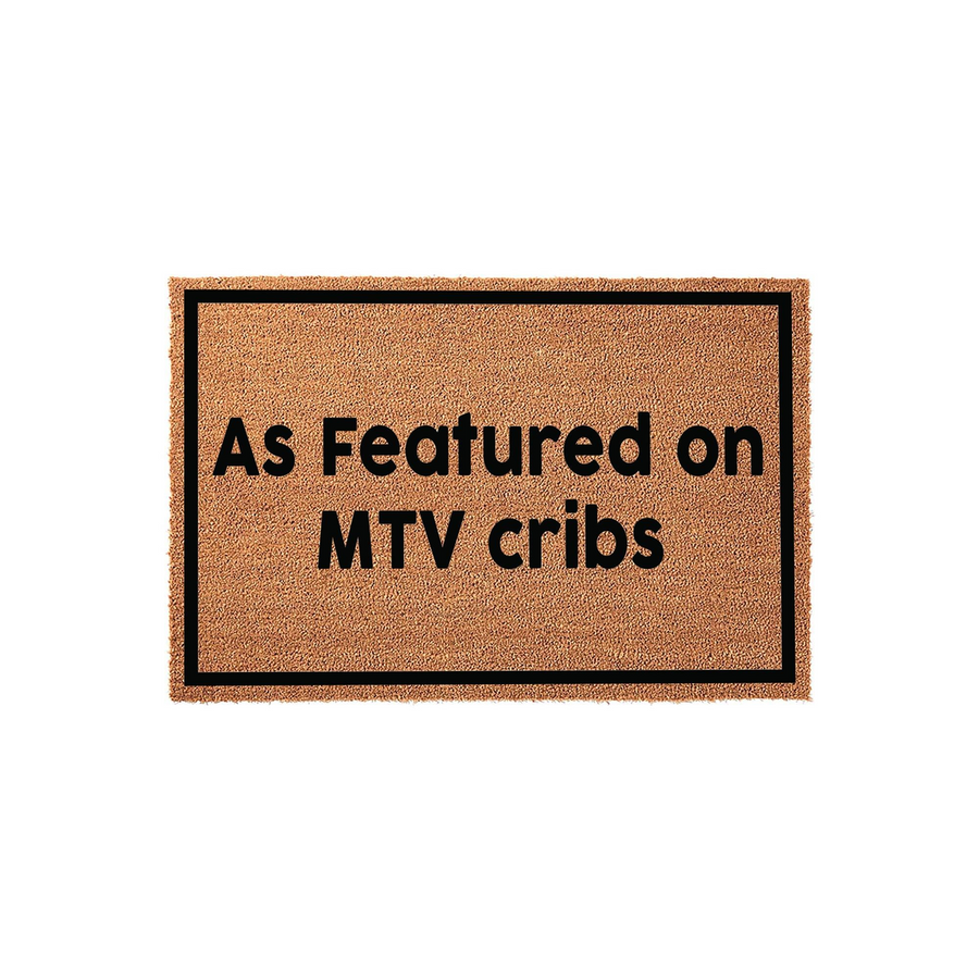 As Featured on MTV Cribs doormat featuring a natural coir fiber texture with a bold black rectangular border and clean sans-serif lettering, providing a fun and nostalgic welcome for any front porch or entryway decor.