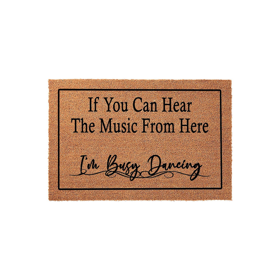 Funny Music Lover Doormat featuring a natural coir texture and a black border, printed with the text If You Can Hear The Music From Here I am Busy Dancing in a mix of bold serif and elegant script fonts on a plain white