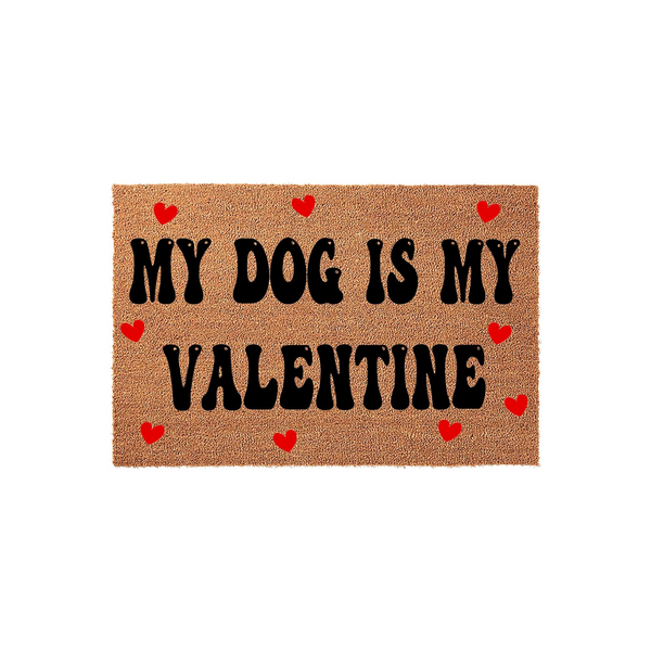 My Dog Is My Valentine coir doormat featuring bold black lettering and small red hearts scattered across the natural brown fiber surface, creating a festive and fun entryway decor piece for any dog lover celebrating the holiday