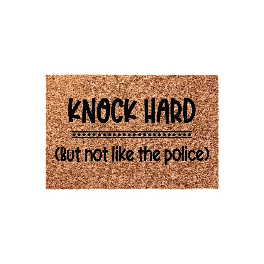 Funny Knock Hard But Not Like The Police doormat featuring bold black text printed on a natural tan coir fiber mat, providing a humorous and welcoming touch to your front porch entryway decor for guests arriving at your home.