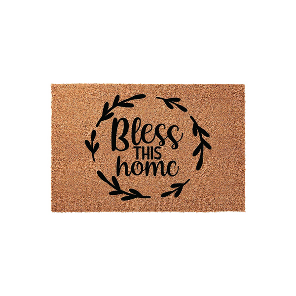 Bless This Home coir doormat featuring a natural tan fiber texture and a black printed design of a leafy wreath surrounding the inspirational text, creating a welcoming farmhouse style entrance for any front porch or entryway.