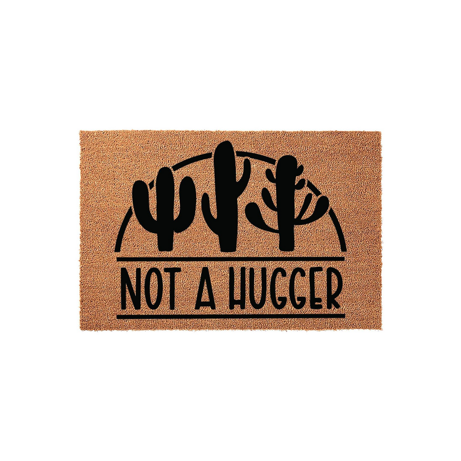 Not a Hugger cactus doormat featuring a natural coir texture with a bold black graphic of three desert cacti under a semi-circle arch, perfect for a funny front porch welcome mat that adds personality to your home entryway decor.