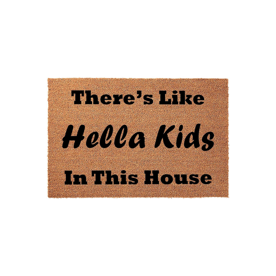 Funny Hella Kids In This House doormat featuring bold black text printed on a natural tan coir fiber mat, creating a humorous and welcoming entryway decor piece for a busy family home with many children living inside the