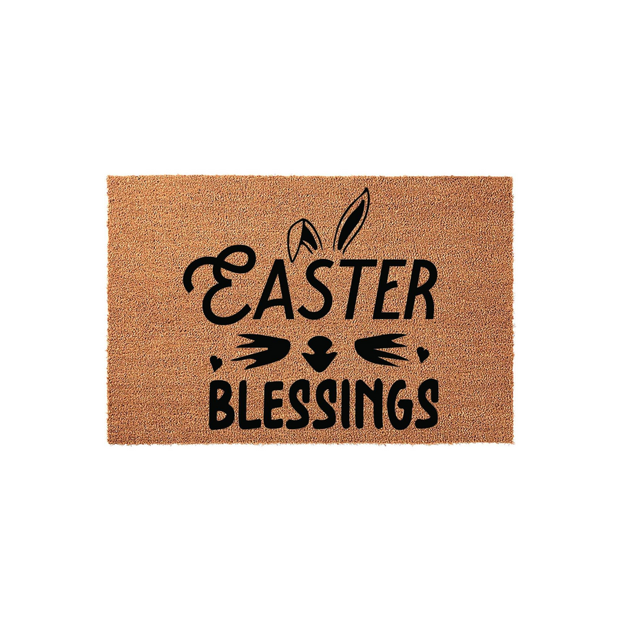 Easter Blessings coir doormat featuring a natural brown fiber texture and black printed text with stylized bunny ears and a nose, creating a festive spring entryway decor piece for your front porch or home entrance during the