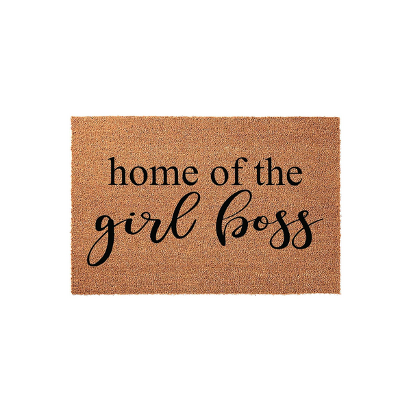 Home of the Girl Boss coir doormat featuring a natural tan fiber texture and bold black lettering, providing a stylish and welcoming entrance for any home office or front porch area that celebrates female entrepreneurship and